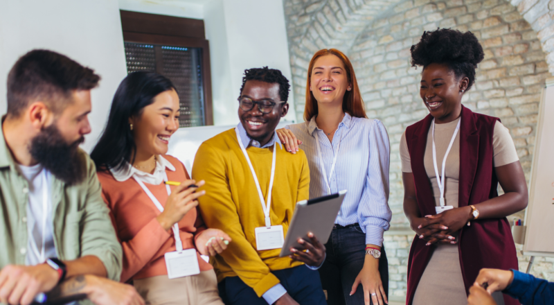 People in an office laughing and smiling