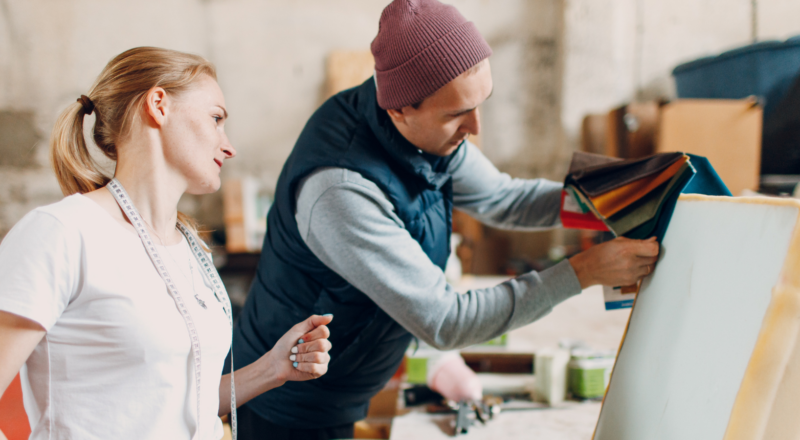 Two people looking at fabrics for office furniture