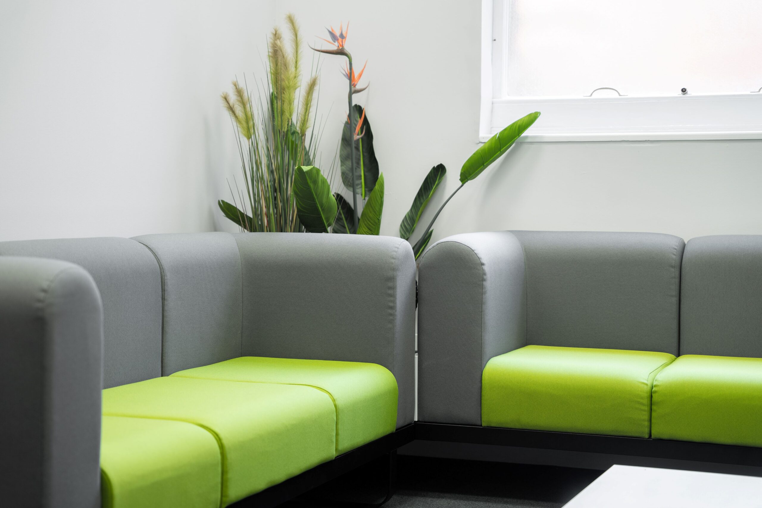 An image of grey and green modular sofas at the Norfolk Chambers of Commerce Business Hub